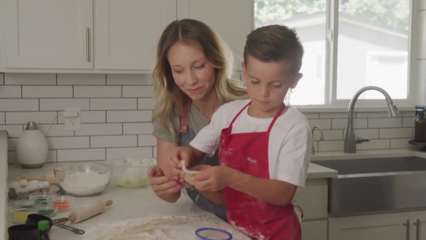Mom and son cooking together in the kitchen