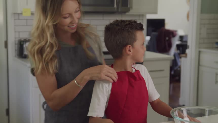 A footage of a mother and son in the kitchen