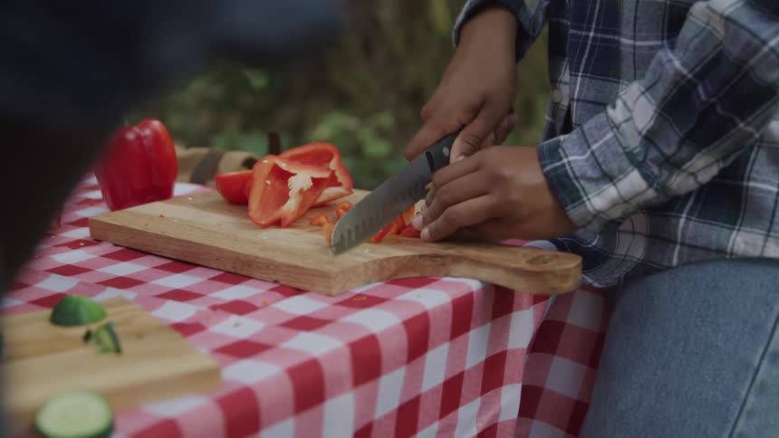 A footage of a person slicing vegetables