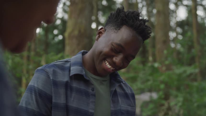 A footage of an teenage boy smiling