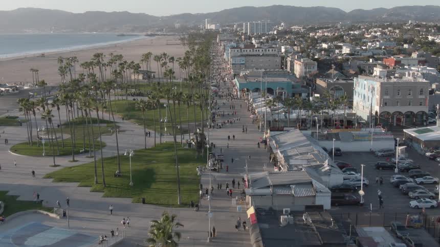 A touristfilled beach waterfront
