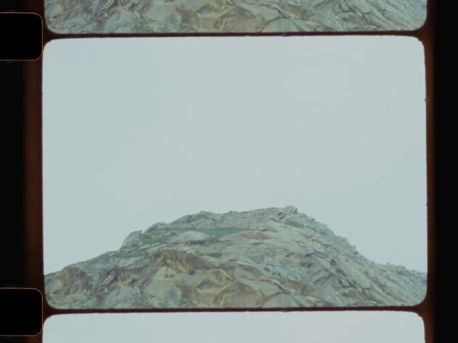 Heavy clouds are over the pile of rocks