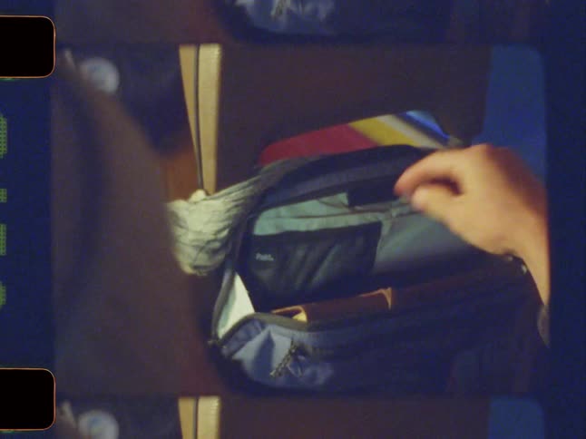 A footage of a person bringing a book out of a bag