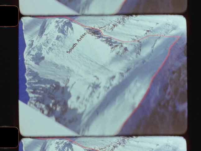 A closeup shows pages flipping in a book revealing colorful pictures of mountains