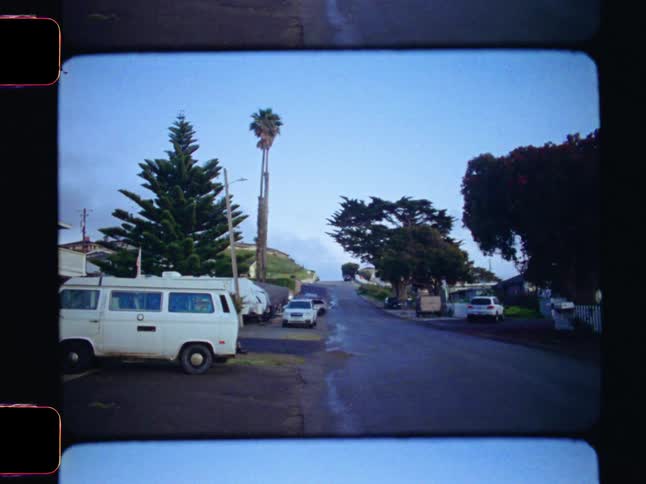 A footage of vehicles parked at the neighborhood
