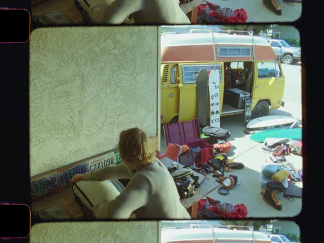 A woman is packing clothes for a trip