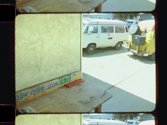 A van drives away from a building