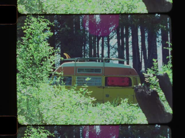 Time lapse of a volkswagon van parked in a forest at night and daytime