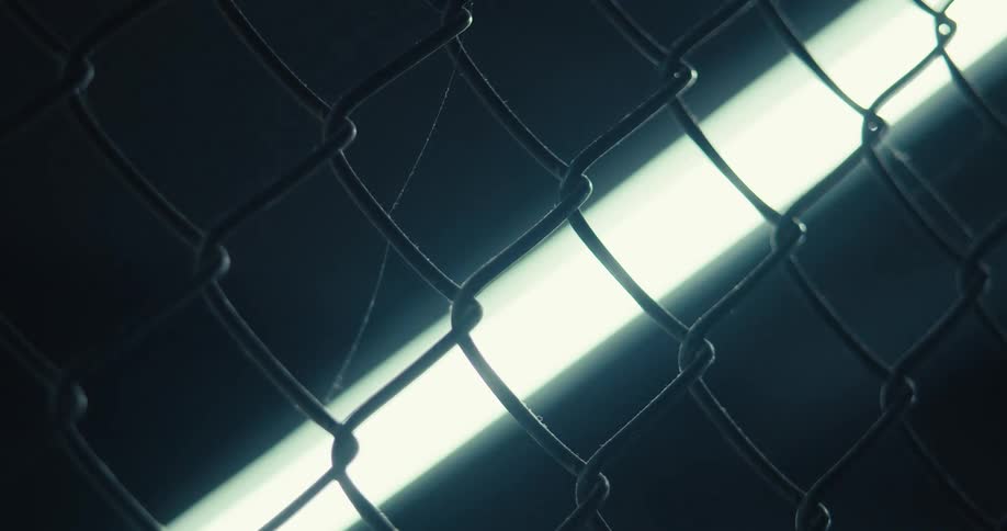 Dark room then the light opens and you see a metal net