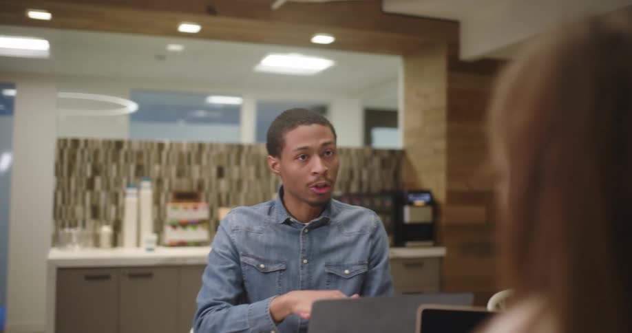 Guys talking in an office