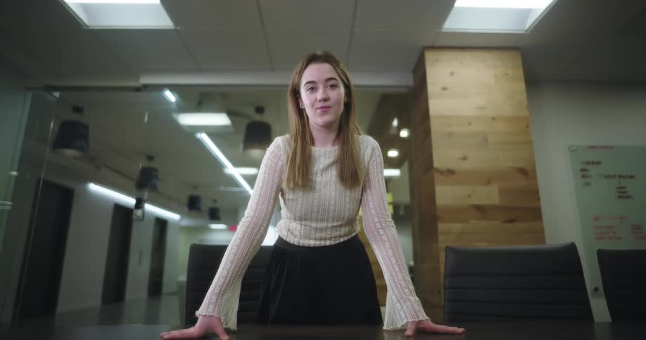 A woman is leaning on the table