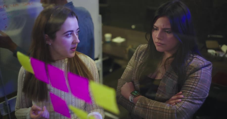 Women are talking asking questions in the office
