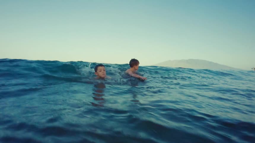 A footage of children playing at the beach