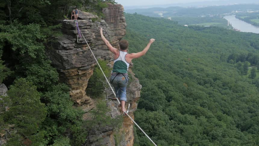 A person tightrope walking