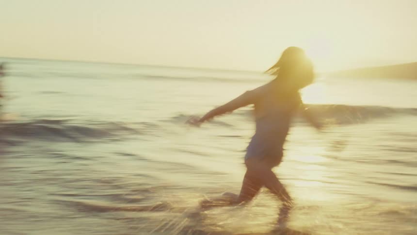 Children run and play on the beach