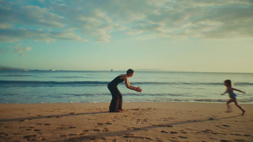 Mom playing with mom on the beach