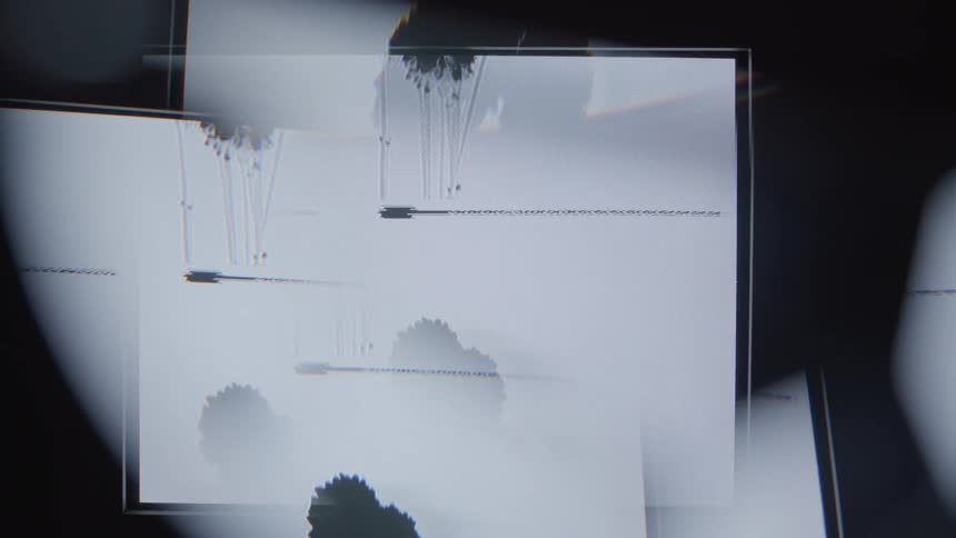 Black ink blots scroll slowly upward across a white display in a looped sequence before flashing and restarting with abstract overlays and flickering visual distortions