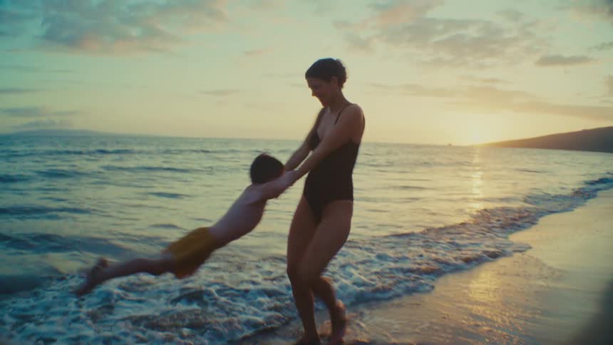 Shared Joy and Motion Between Mother and Child by the Sea