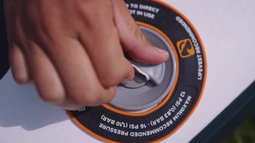 A person turns the switch on the machine