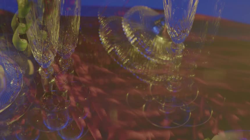 A table with glasses and glassware on it