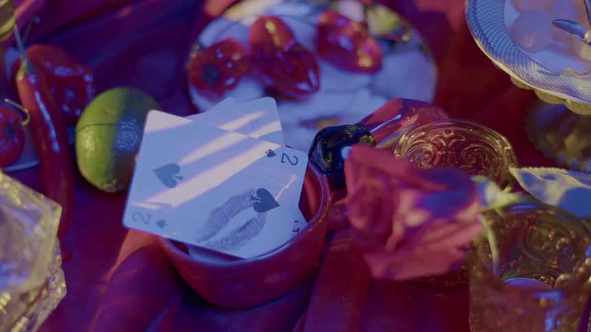 Sunlight flickers and reflects off a picnic set up on a blanket