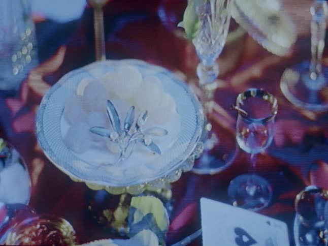 The table is full of glasses and plates
