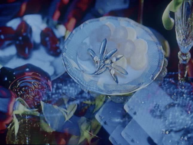 Table with various objects on it made of ceramics and glass