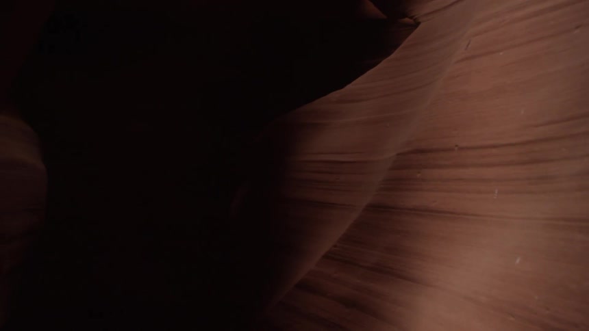 The inside of a cavern is dark with turns