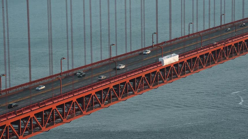 Time lapse of commuters driving across golden gate bridge in san francisco during the day