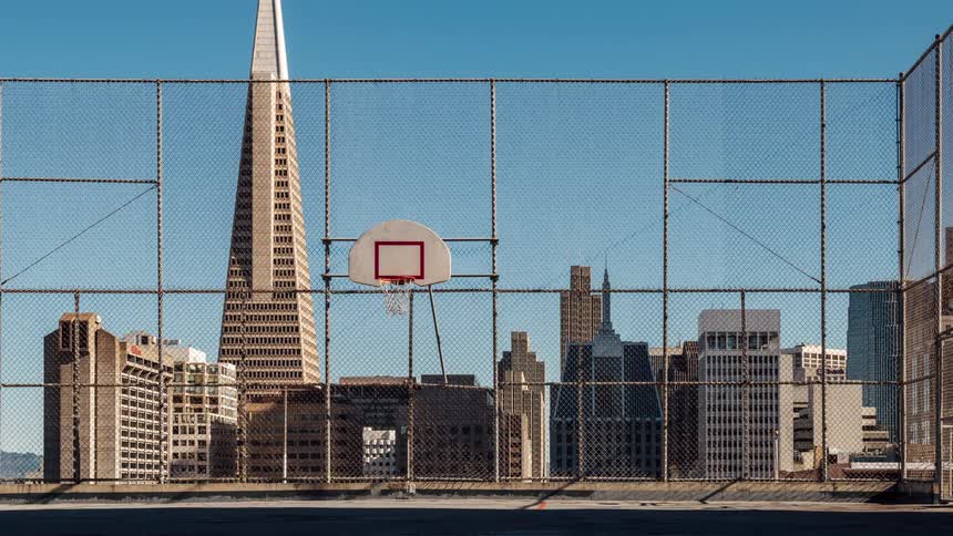 A man is shooting the basketball on the court