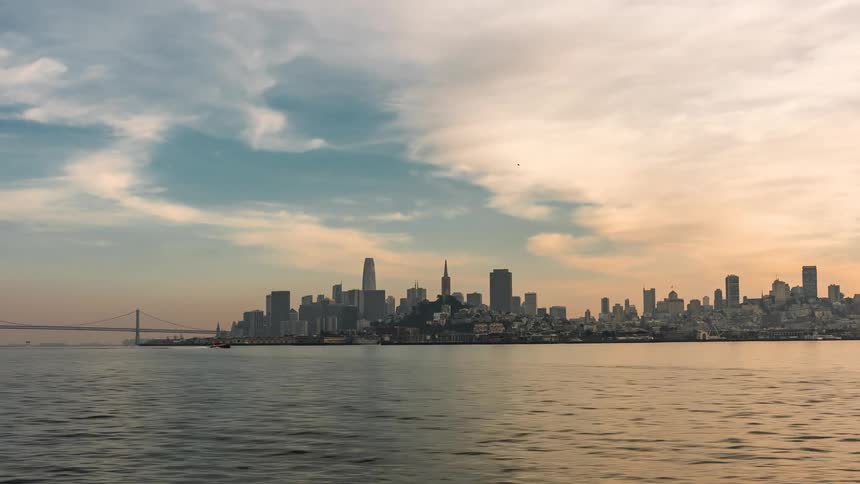 A ferry travels past the city