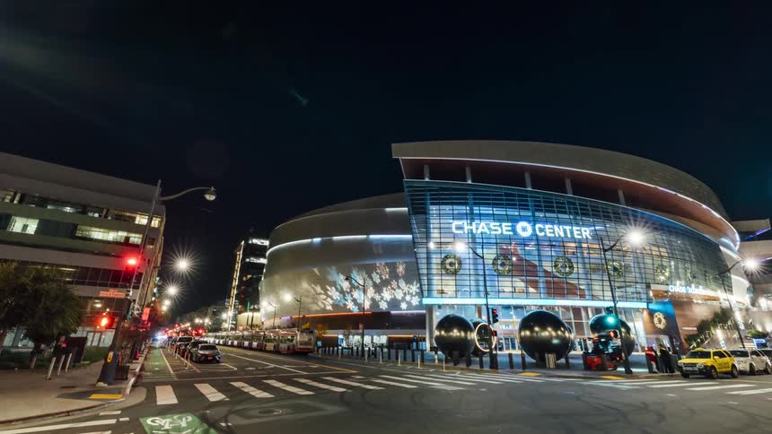 Cars pass by on the intersection by the stadium