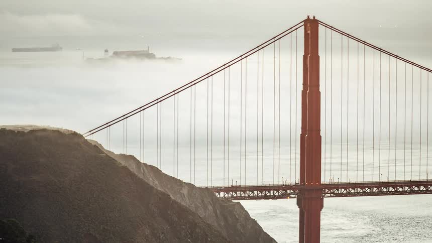 Time lapse of fog rolling across golden gate bridge