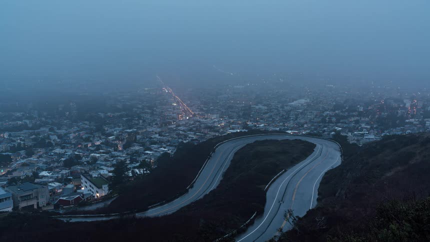 Night view of a metropolis with fog and lots of lights