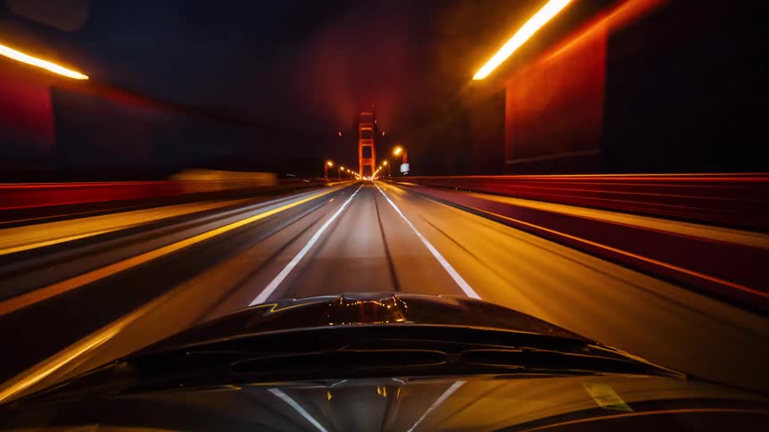 View from a car crossing a road and bridge