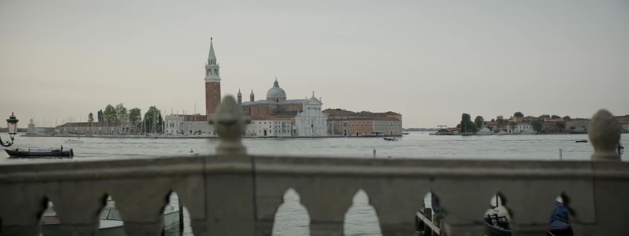 Large building seen across a body of water