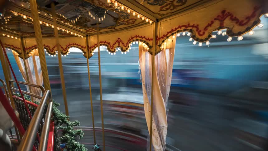 Merry go round rotates rapidly during the daytime