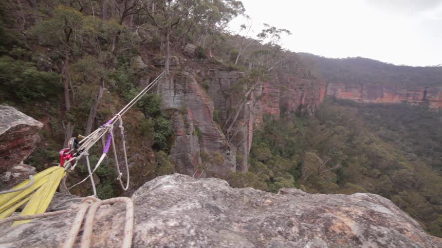A rope is stretched between canyons