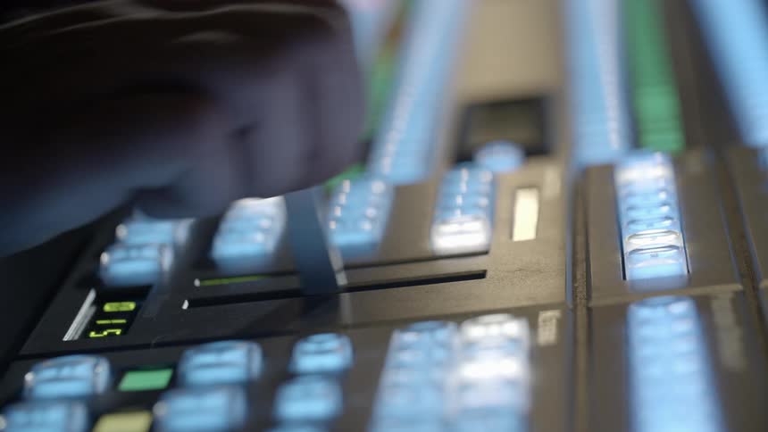 A person operating a television switcher
