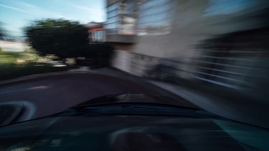 A car makes turns while traveling through the city