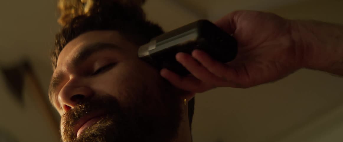 Boy whose hair is cut with a razor