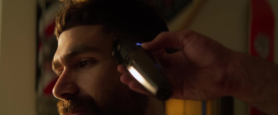 Boy whose hair is cut with a razor