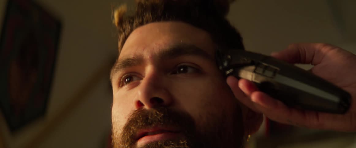 Boy whose hair is cut with a razor