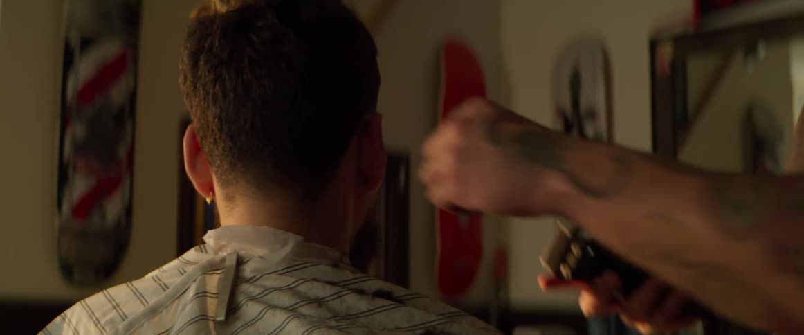Boy whose hair is cut with a razor