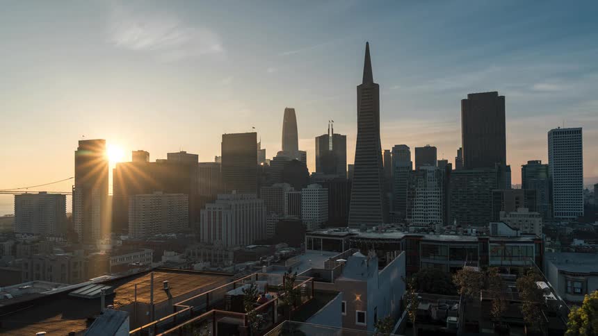 Building lights go out as night becomes day