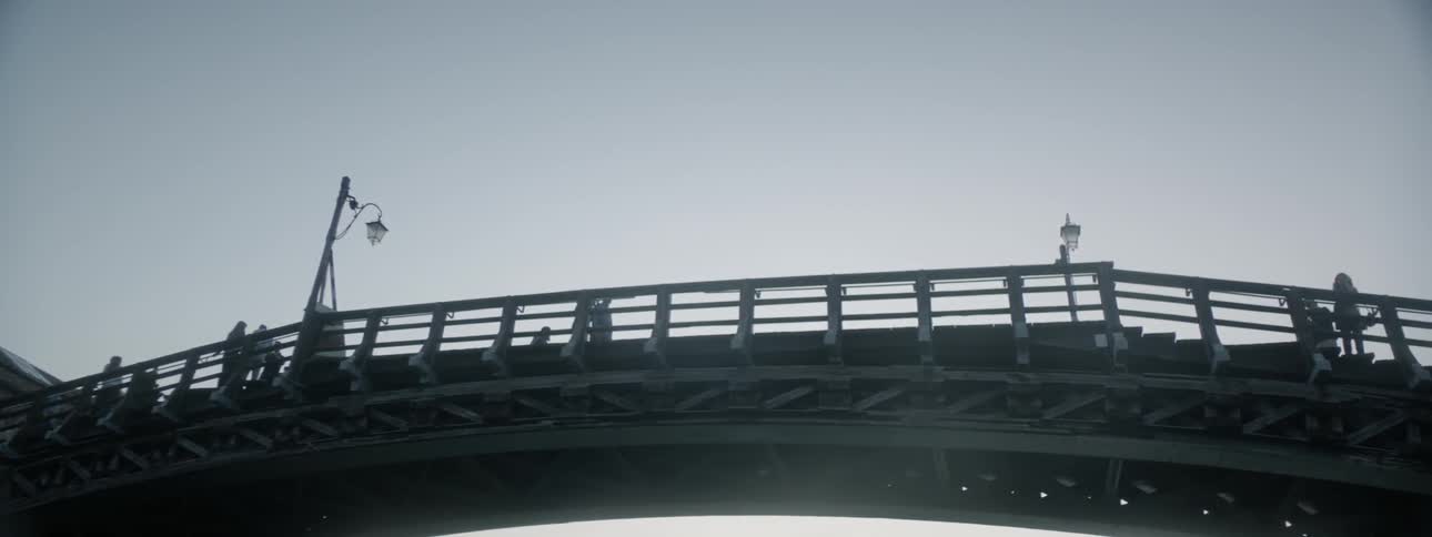 People cross this overpass above on a clear day