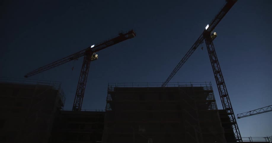 There are construction cranes on all the buildings being built