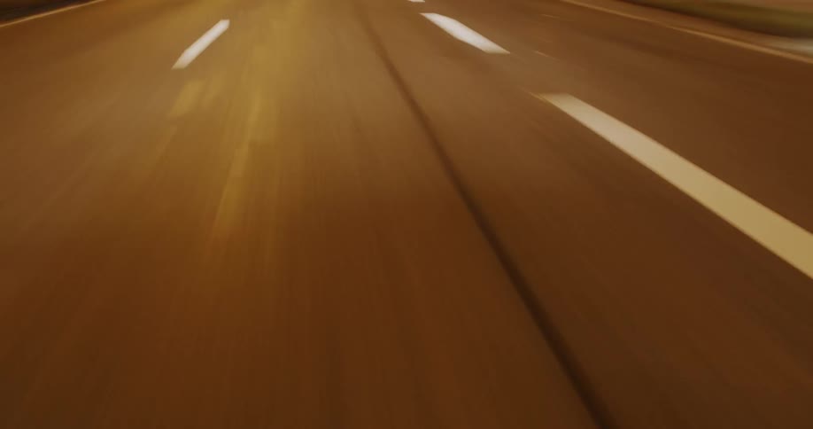 A road at night with white lane markings