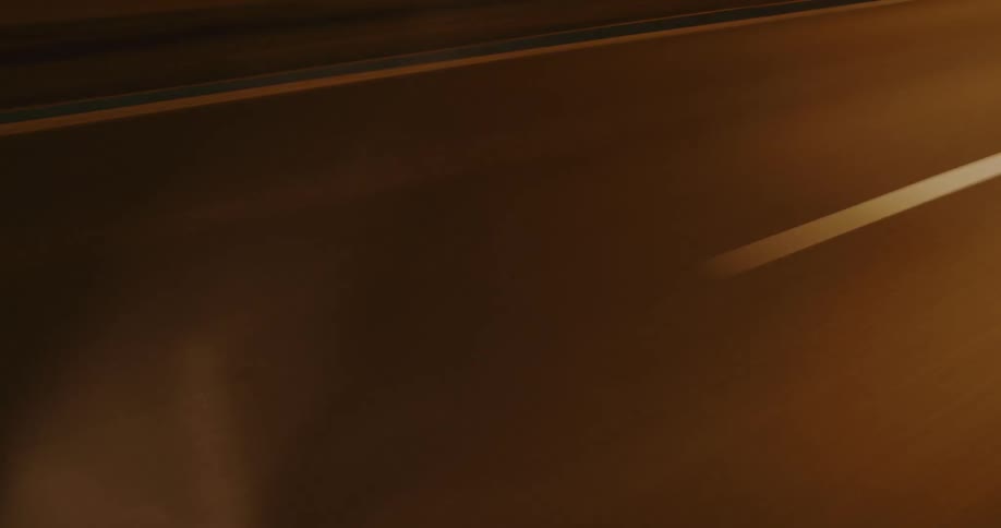 Headlights light up the road