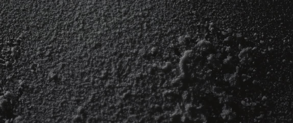 Strange looking material seeming to be vibrating on a flat surface